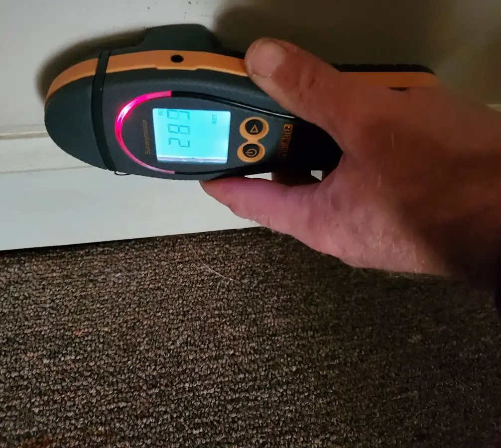 Moisture detection at baseboard during Storm Damage Restoration in Montgomery